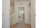 Bright hallway leading to a bedroom with natural light from a window at 5520 White Marlin Ct, New Port Richey, FL 34652