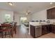 Open-concept living space with dining area, a breakfast bar, stainless steel appliances and access to a private balcony at 5520 White Marlin Ct, New Port Richey, FL 34652