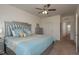Beautiful bedroom featuring a comfy bed, ceiling fan, and ample natural light at 5520 White Marlin Ct, New Port Richey, FL 34652