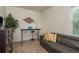 Office space featuring a sleek desk, comfortable seating, and natural light at 5520 White Marlin Ct, New Port Richey, FL 34652
