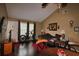 Living room with vaulted ceiling, wood floors, and entry door at 6338 Spring Flower Dr # 21, New Port Richey, FL 34653