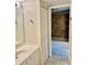 Bathroom featuring a vanity and a view of the tiled shower and tub at 6462 92Nd N Pl # 806, Pinellas Park, FL 33782