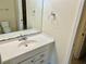 The bathroom features a sink, mirror, and toilet at 6462 92Nd N Pl # 806, Pinellas Park, FL 33782