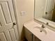 Bathroom featuring single sink vanity with ample counter space and a large mirror at 6462 92Nd N Pl # 806, Pinellas Park, FL 33782