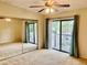 This bedroom has sliding glass doors that lead to a small patio at 6462 92Nd N Pl # 806, Pinellas Park, FL 33782