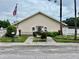 Community building with nicely landscaped entrance, flag, and mailboxes at 6462 92Nd N Pl # 806, Pinellas Park, FL 33782