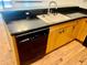 Kitchen with black dishwasher, cabinets, and stainless steel sink at 6462 92Nd N Pl # 806, Pinellas Park, FL 33782