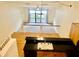 Open-concept kitchen with wood cabinets and view to the living space at 6462 92Nd N Pl # 806, Pinellas Park, FL 33782
