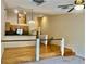Living room with hardwood floors, open layout, and modern lighting at 6462 92Nd N Pl # 806, Pinellas Park, FL 33782