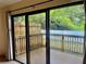 View of wooden deck with fenced in yard through the glass sliding doors at 6462 92Nd N Pl # 806, Pinellas Park, FL 33782