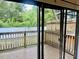 View of wooden deck and fenced in yard through the glass sliding doors at 6462 92Nd N Pl # 806, Pinellas Park, FL 33782