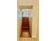 Wooden stairway leading to an upper level with natural light and neutral walls at 6462 92Nd N Pl # 806, Pinellas Park, FL 33782
