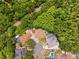 An aerial view of a property surrounded by lush greenery and nearby pools at 6505 Broadwing Ct, Tampa, FL 33625