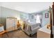 Cozy bedroom with a full bed, dresser, and serene pastel-colored walls at 6505 Broadwing Ct, Tampa, FL 33625