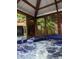 In-ground covered hot tub is perfect for relaxing and enjoying nature views at 6505 Broadwing Ct, Tampa, FL 33625