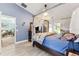 Bright main bedroom featuring canopy bed and views of the outdoor scenery at 6505 Broadwing Ct, Tampa, FL 33625