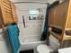 Bathroom with a tub and shower, bamboo storage, and modern fixtures at 717 Whiteway Dr, Brooksville, FL 34601