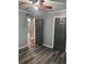Bedroom with luxury vinyl plank floors, two closets, and a ceiling fan at 717 Whiteway Dr, Brooksville, FL 34601