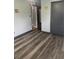 Bedroom featuring modern flooring, neutral walls, and ample space at 717 Whiteway Dr, Brooksville, FL 34601