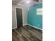 Bedroom featuring two-tone paint, ceiling fan, luxury vinyl plank flooring and a closet at 717 Whiteway Dr, Brooksville, FL 34601