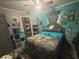 Cozy bedroom featuring a comfortable bed, stylish decor, and storage solutions at 717 Whiteway Dr, Brooksville, FL 34601