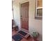 Inviting entryway with a stylish door, decorative plants, and a 'Welcome' mat at 717 Whiteway Dr, Brooksville, FL 34601