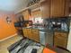 Inviting kitchen with stainless steel appliances and ample countertop space at 717 Whiteway Dr, Brooksville, FL 34601