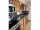 Well-equipped kitchen featuring stainless steel appliances and stylish backsplash details at 717 Whiteway Dr, Brooksville, FL 34601