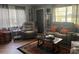 Cozy living room featuring hardwood floors, a stylish rug, and comfortable seating at 717 Whiteway Dr, Brooksville, FL 34601