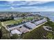 Aerial view of a boatyard, marina, and surrounding neighborhood with coastal access at 7303 Hatteras Dr, Hudson, FL 34667