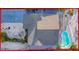 Aerial view of a home featuring a pool, a patio, and a surrounding backyard at 7303 Hatteras Dr, Hudson, FL 34667