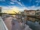 Private boat dock with a boat lift showcasing the waterfront living and stunning sunsets at 7303 Hatteras Dr, Hudson, FL 34667