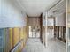 Hallway with tiled floors under renovation, ready for customization and upgrades to enhance the overall design and functionality at 7303 Hatteras Dr, Hudson, FL 34667
