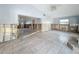 Large living room with tile floors, light blue walls and views to the kitchen at 7303 Hatteras Dr, Hudson, FL 34667