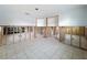 Spacious living room during the remodeling process, displaying a tiled floor and layout ready for customization and finishing touches at 7303 Hatteras Dr, Hudson, FL 34667