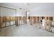 Under-construction living room with an open floor plan, showcasing tile floors and remodeling potential at 7303 Hatteras Dr, Hudson, FL 34667