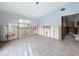 Bright room showcasing tiling, featuring a window and doorway, awaiting your personal renovation touches and design ideas at 7303 Hatteras Dr, Hudson, FL 34667