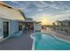 The backyard features a private pool, perfect for relaxation and entertaining with beautiful sunny skies at 7303 Hatteras Dr, Hudson, FL 34667