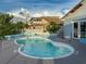 Kidney-shaped pool with white fencing and depth markings at 7303 Hatteras Dr, Hudson, FL 34667