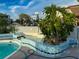 This pool includes a decorative tiled planter for added visual appeal to your outdoor oasis at 7303 Hatteras Dr, Hudson, FL 34667