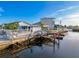 Waterfront home with backyard, dock, boat lift, and fenced yard at 7303 Hatteras Dr, Hudson, FL 34667