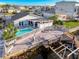 Waterfront home featuring a pool, backyard, dock, and boat lift on a sunny day at 7303 Hatteras Dr, Hudson, FL 34667