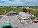 Aerial view of an outdoor restaurant with waterfront views, tiki bar and plenty of parking available at 7303 Hatteras Dr, Hudson, FL 34667