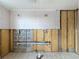 Room undergoing renovation, showing exposed pipes and partial tile work on walls at 7303 Hatteras Dr, Hudson, FL 34667