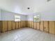 Renovation room exhibiting exposed framework, windows, and tiled flooring at 7303 Hatteras Dr, Hudson, FL 34667