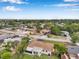 This single-Gathering home is located in a quiet residential area, with lush greenery, a long driveway, and well-kept lawns at 7316 Tangelo Ave, Port Richey, FL 34668