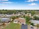 Aerial view of a neighborhood featuring a well kept home with lush landscaping at 7316 Tangelo Ave, Port Richey, FL 34668