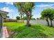 Picturesque backyard featuring mature trees and a well-maintained lawn at 7316 Tangelo Ave, Port Richey, FL 34668