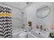 Beautiful bathroom features a stylish vessel sink, round mirror, and shower-tub combo at 7316 Tangelo Ave, Port Richey, FL 34668