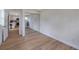 Bedroom featuring wood-look floors and closet with mirrored doors at 7316 Tangelo Ave, Port Richey, FL 34668